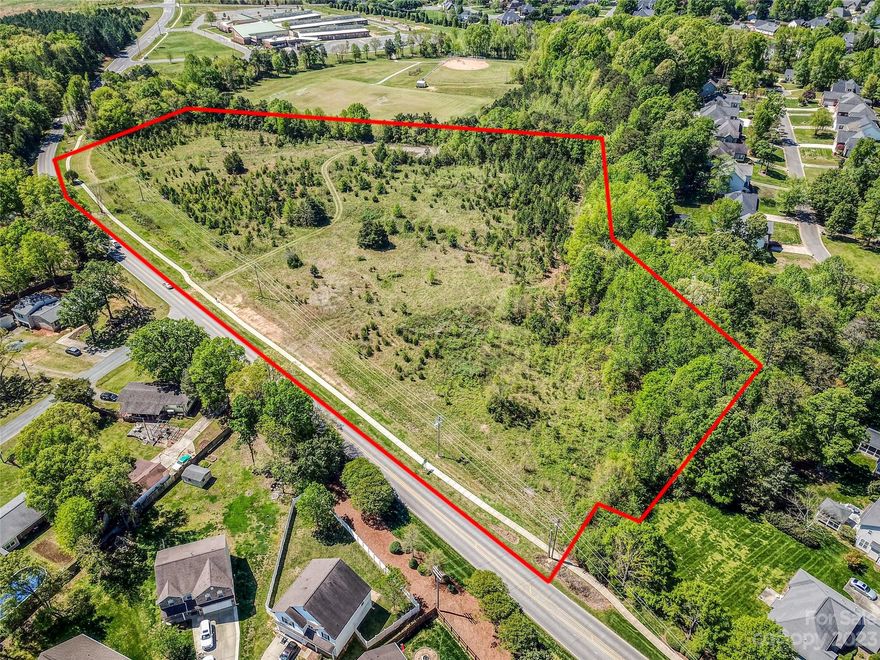 Multiple parcels totalling 10+ acres of residential land for sale in Stallings NC. The land is in a high profile area next to Stallings Elementary with easy access to Matthews NC and easy access to I-485 and Hwy. 74.   This land consist of 6 parcels and currently is configured as five .9+/- acre lots and one 5+ acre lot.  Owner has had preliminary soil reports completed and there are multiple sites that seem to be suitable for septics.  Further action is required to confirm the exact number and locations of proposed septic sites.  Sewer is close but not directly connected to property.  County water is available across the street and the buyer will need to determine the process and cost to hook up to that water line.  Great investment property or site for redevelopment.