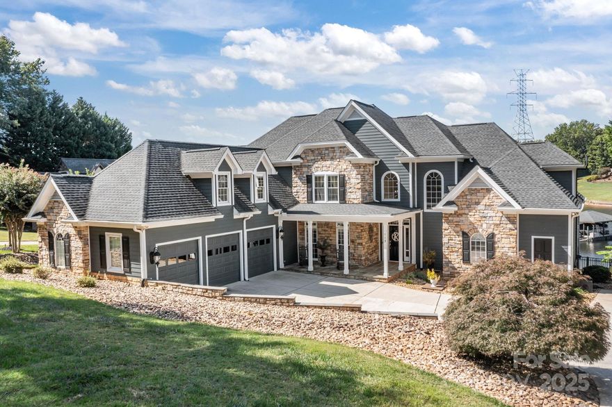 Waterfront living at its finest in this luxurious four-bedroom home. This home truly has it all. Deep water covered boat slip with boat lift. The in-ground 16x32 salt water swimming pool has plenty of room for lounge chairs and tables. Three-car garage with epoxy floors. Covered rocking chair front porch. Hardwood floors throughout. The spacious main level primary suite features a sitting area, cathedral ceiling and dual walk in closets. The primary bath has dual vanities, a jetted tub, large custom shower and tile floors. Recessed lighting throughout the home. The family room has a two-story ceiling and a gas log stone fireplace. Enjoy a great view of Lake Norman from most rooms. The kitchen features granite countertops and built-in kitchen appliances. The kitchen island has an electric cooktop with a Thermador exhaust fan. Two wet bar areas are adjacent to the kitchen. The keeping room also has a gas log stone fireplace. The laundry room has a mudroom sink with cabinets and tile floors. Washer and Dryer to remain. A spacious drop zone room provides plenty of cabinets and storage with tile floors. The spacious covered deck has ceiling fans, recessed lighting, and pull-down shades. The covered boat slip is located in a protected cove adjacent to the main channel. Fenced backyard. Meticulous hardscape landscaping in both the front and backyards. Upstairs has an additional primary suite with full bath and two additional  bedrooms, with a Jack & Jill bath. Upper level also includes a study/office, plus very large rec room with a window seats. There is a ample walk-in storage off the rec room.