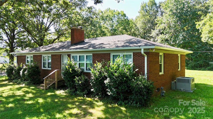 Well-maintained brick ranch situated on over an acre in Indian Trail. This 3 bedroom, 2 bath home offers a functional floor plan with two living areas and hardwood flooring throughout much of the home. Updates include the conversion of a half bath into a full bath, a septic inspection and pump out in 2023, installation of 6" gutters and a new crawl space vapor barrier/ insulation. Exterior features include a covered carport, storage shed and a spacious yard with mature trees. Located outside of an HOA and within the Porter Ridge school district. Convenient to the Monroe Bypass and Highway 74 for commuting. Property is being sold as-is—give us a call today!