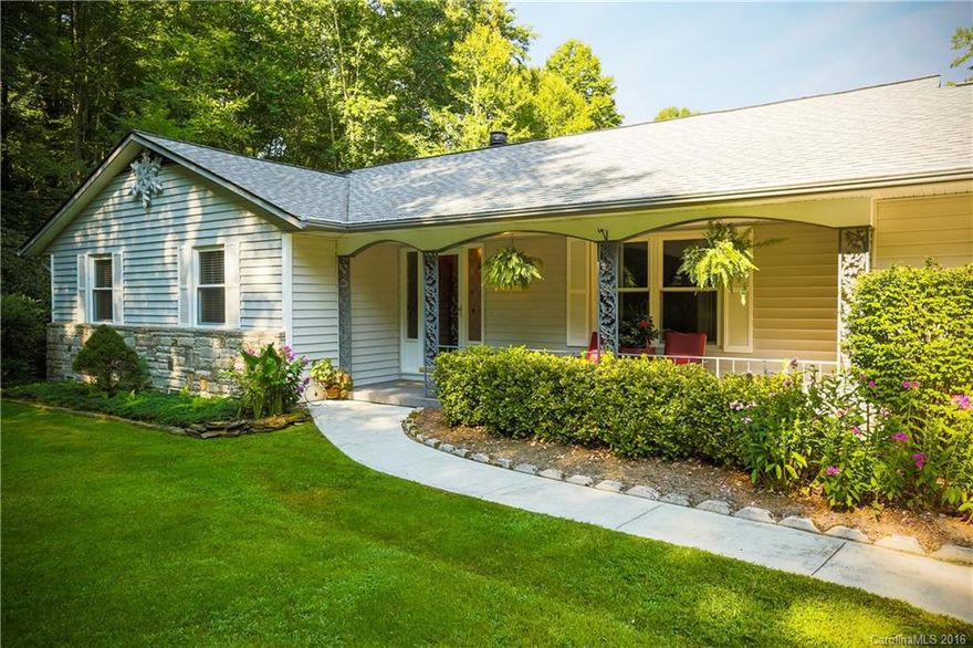 Immaculate house and 2 car garage.  Mature landscaping, two creeks, beautiful expansive lawn.  Updated 3 bedroom septic.  Glass bonus sun-room.  Practically new with all of the updates and replacements.  Gas heat and air!  A real Must See!!