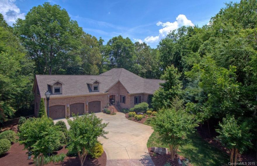 Stylish waterfront home in the Clover school district. 1.5 acres with lots of privacy & trees. Ranch style home w/ bonus over 3 car garage. Gorgeous kitchen, open to living area. Granite counter tops, large island work area w/ eat-in bar, stone backsplash. Exotic wood floors in living area. Sunroom, huge deck to enjoy the natural surroundings. Lakeside patio, dock w/ PWC dock, boat lift, swim platform. Quiet cove ideal for paddling around, opens to Big Allison inlet for boating and water sports.