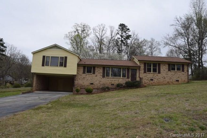 Beautiful split level home with tons of living space for a growing family!  Cathedral ceilings and exposed beams in great room.  Spacious kitchen with new appliances, all stainless.  Floor to ceiling windows with lots of natural lighting.  Both HVAC units are brand new!! New roof, new carpet, new tile flooring in bathrooms, and fresh paint throughout.