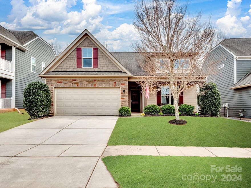 This captivating 1.5 story home in the sought out community of Walnut Creek offers a functional and stylish layout. Featuring a welcoming front porch, the home flows into an open floor plan with a well-equipped kitchen boasting granite countertops and stainless steel appliances. The primary suite on the first floor boasts a luxurious en suite bath with a soaking tub, walk-in shower, and double vanity. Upstairs, a large loft area provides the perfect space for a home office or entertainment area, while a full bath and additional bedroom offer comfortable accommodations. The backyard oasis features a covered patio, perfect for relaxing and enjoying the natural surroundings. Community amenities include 2 pools, playgrounds, ball fields,  walking trails, gym, tennis courts and more.