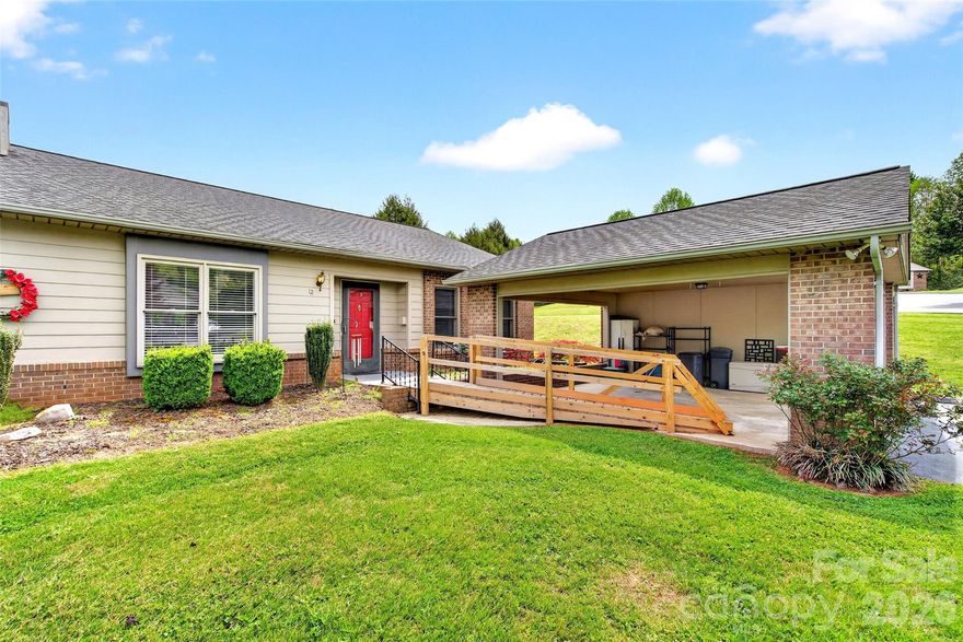 Beautifully updated townhome located in the desirable Deer Run Subdivision. There is an oversized carport with pull down steps to access attic storage. The carport also has a ramp for easier home entry. The home features an open great room, dining area and kitchen. The kitchen has been freshly updated with lovely painted cabinets, beautiful granite countertops, stainless appliances, backsplash, pantry and a moveable bar. One of the best features of this home is a lovely glassed sunroom that overlooks the backyard. It, also, has a roomy storage closet. A newer deck has been added in the back yard. The primary bedroom has an updated bath with an attractive walk in shower, mirrored cabinet and tile flooring. There is a walk in closet. The washer and dryer are conveniently located in the hallway. The second bedroom has a roomy closet and is located next to the hall bath with tile shower and flooring and pretty vanity with good storage under it. Many of the windows throughout home feature attractive blinds. The crawlspace has some space for storage.