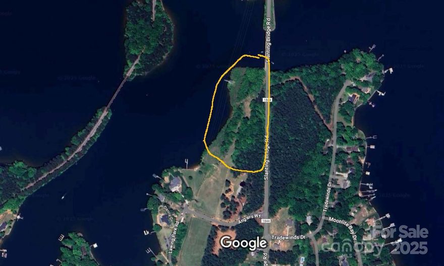 Rare Lake Norman Waterfront Development Opportunity. 6.4 acres with private beach access & 802' road frontage on Slanting Bridge Rd. <2 developable acres outside transmission easement perfect for event venue, restaurant, or luxury estate(s). Beach accessible from water (not dock-able). R-30 zoned, commercial potential requires rezoning. Unique combination: waterfront views, easement provides ample parking solution. Ideal for wedding venue/B&B, boutique restaurant, or custom waterfront home(s). Un-entitled land priced for development potential. Minutes to Lake Norman amenities, Marshall Steam Station proximity. Serious inquiries only - exceptional property for right buyer vision.