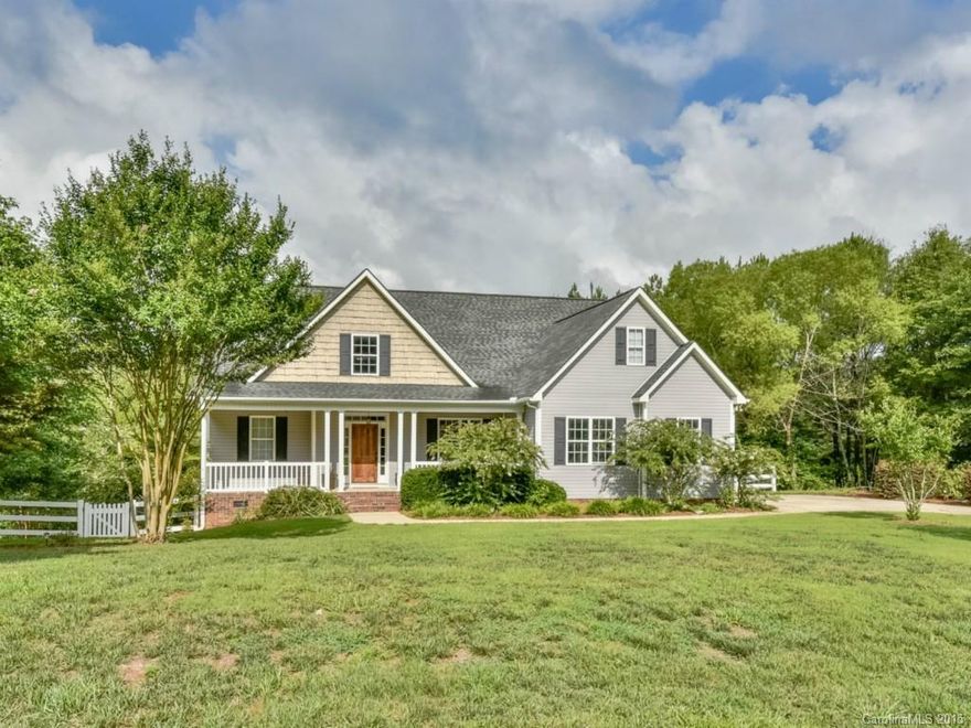 Custom home with rocking chair front porch and open, flowing floor plan offers easy lifestyle/entertaining at its finest! Beautiful country setting close to the conveniences/amenities of city life. Gorgeous hardwood floors, new carpet, spacious master suite with spa-like bath on main level; guest suite on main level; cook's kitchen; huge bonus/media room, loft. Multi-level deck and pool, fenced yard. Situated on 1.3 private, wooded acres. Top rated schools. Low taxes. Impeccable condition.