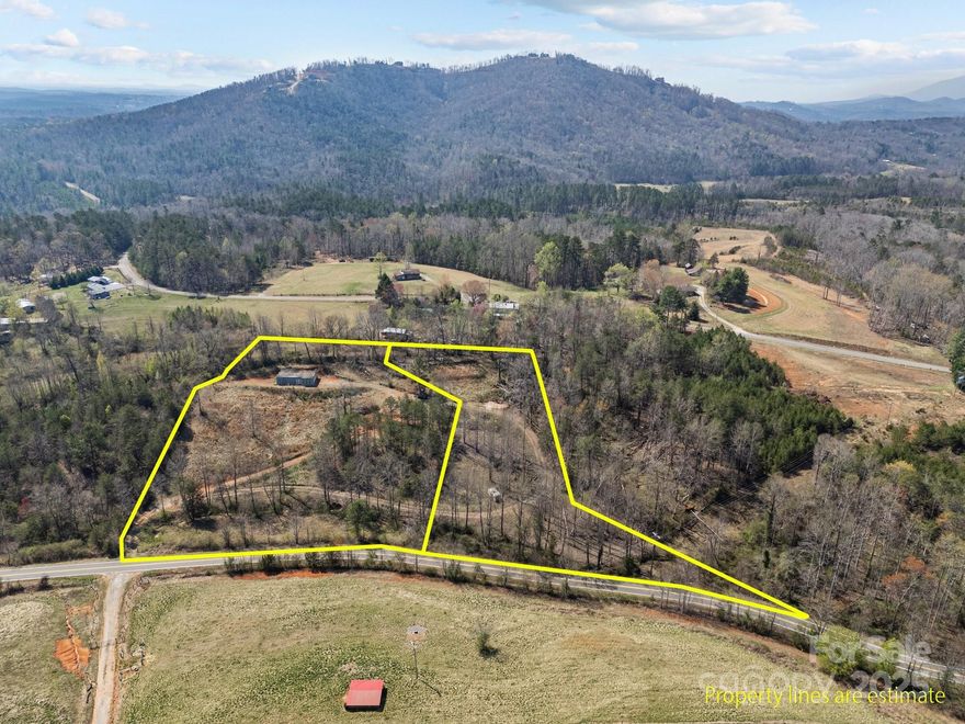 Private 5.57 Acres sitting atop a hill. Gorgeous views! Two buildable and cleared lots - one with basement completed. Well and septic (approved for 3 bedrooms) are installed. Running water and electricity.