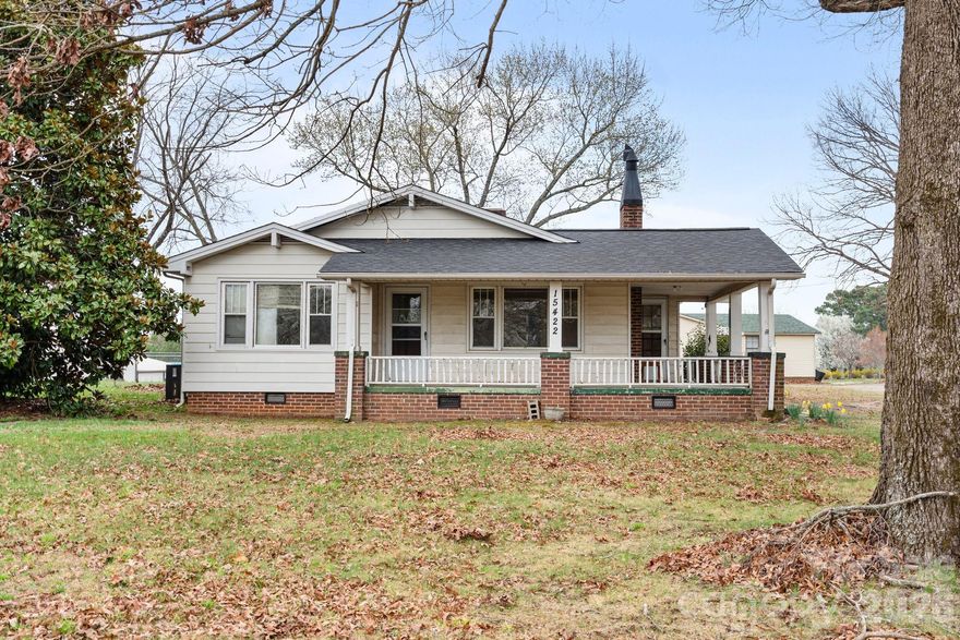 Set on a generous 1.84 acre lot, this unique property offers two homes on two parcels of land, presenting a rare opportunity for multi-generational living, rental income or guest accommodations. The primary residence features 3 bedrooms and 2 bathrooms, highlighted by a charming brick fireplace and elegant arched doorways that add warmth and character throughout the living space. The thoughtfully designed layout places the private primary suite on its own side of the home, while the two spacious secondary bedrooms, each with walk-in closets, share a convenient full bath. Outside, you'll find a large back deck overlooking the expansive property, creating the perfect setting for outdoor dining, entertaining or relaxing summer evenings.

The second home offers 2 bedrooms and 1.5 bathrooms and is filled with timeless details, including beautiful original wood flooring and a spacious covered front and side porch. Inside, you’ll find a large living room, dedicated dining room, private primary suite and a bright sunroom ideal for morning coffee or evening cocktails. With a bit of TLC, both homes offer incredible potential to truly shine, all set on your own private and spacious 1.84-acre retreat.