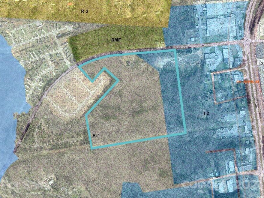Four parcels totaling 80.86 acres. Majority is currently zoned R-1 with some RMF and I-2. City water and sewer on Crowders Creek Rd. Two rental homes included in the sell are located on PID#205572 and both have city water and sewer. This property is located in Federal Opportunity Zone. Parcels included are 205573,145106,205572 and 145107.