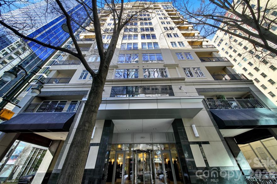 This is the lifestyle you have been looking for! High floor in an A++ building.  This extra large corner condo overlooks bustling S. Tryon Street and has sparkling night views.  Oversized patio includes direct piped grill and ample space for entertaining or relaxing. Open split double master plan is thoroughly upgraded including flooring, lighting fixtures, black stainless appliances and new HVAC in 2025.  Concierge, fitness center, pool and community rooms with billiards.  Secure building.  2 designated parking spaces in attached deck. 1 block from Romare Bearden parks' huge lawn and fountains.  Easy walk to Baseball, Panther stadium,  arena, museums and lots of restaurants.  1 Block to light rail.  You can travel and just lock the door and not worry about a thing.  But you will always look forward to coming home.