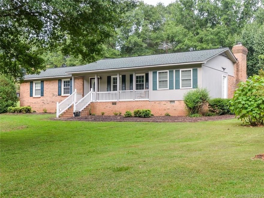 Space and privacy galore!! Beautiful brick home on 1+ acre lot on quiet street with established shade trees, large fenced area, two large storage outbuildings, covered back porch, and rocking chair front porch. Inside features a large kitchen, open floorplan, gas log masonry fireplace, ceiling fans, and so much more! Roof is less than 10 years old, all windows have been updated with vinyl, HVAC is from 2016, all carpet is brand new, and all new insulation in the attic in 2012. Clover schools!!!