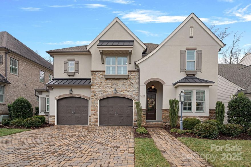 Pristine Classica built home in gorgeous Providence Retreat! We love the upscale features in this community - the custom paver driveways, gas lanterns, & tree lined streets w/sidewalks. This immaculate home offers an abundance of modern features & upgrades. Main level includes guest suite w/full bath, large kitchen open to dining, family room + built-in office /homework space. A perfect place for "home central!"  Upstairs is an ample bonus room, ideal as an entertainment/play area. All bedrooms have access to full baths. Primary suite is set apart w/beautiful views of the wooded back yard. Primary bath is simply incredible w/ a spacious shower w/two shower heads, separate vanities + 2 large walk-in closets. Laundry room is ideally located on the second floor w/ direct access to one of the primary closets and off the secondary bedroom wing. Covered back porch + patio overlook a wooded area offering the ultimate in privacy.  Close to the Arboretum, Waverly, Ballantyne, Charlotte Latin.