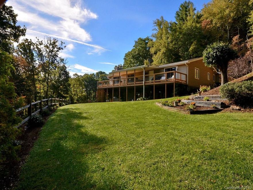 AMAZING PROPERTY! 11.55 acres MOL w/ 3BR/3BA home. Convenient to VA, Warren Wilson, downtown Asheville & Black Mountain. Lots of privacy & beautiful park-like setting. Main level has Master bed/bath with deck access, open concept great room with fireplace & vaulted ceilings, dining with deck access, spacious kitchen, laundry room, 2nd bed/bath & double garage. Lower level has bed/full bath & workshop/storage space that could be finished. Property has tons of potential for additional development.