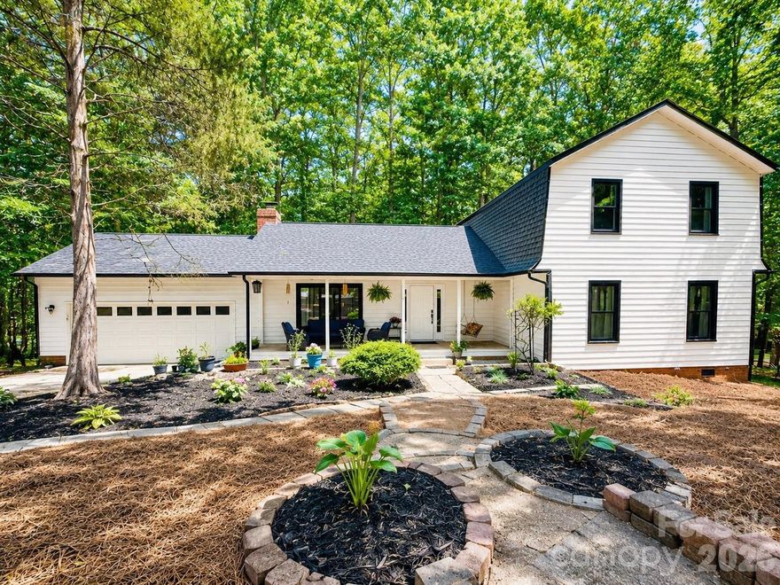 Welcome to this beautiful modern farmhouse-style home nestled on a private 0.7-acre wooded lot in the highly desirable Raintree community. Offering 4 bedrooms, 2.5 baths, and a 2-car garage, this home combines timeless charm with modern comfort and functionality.  

Step inside to an inviting open floor plan featuring brand-new 3/4-inch solid hickory hardwood floors on the main floor, a cozy wood-burning fireplace, abundant natural light, and seamless flow for everyday living and entertaining. The renovated modern kitchen is equipped with smart appliances, stylish finishes, and ample space for gathering with family and friends.  

The spacious primary suite is conveniently located on the main floor. Thoughtful upgrades throughout include a brand-new roof, new front door, new patio door, new windows in the kitchen area, renovated upstairs bathroom, and a whole-house water filtration system for added peace of mind.  

Enjoy the beauty and privacy of your expansive wooded homesite while still being just minutes from shopping, dining, top-rated schools, and easy access to I-485. As an added bonus, the Raintree Country Club initiation fee is waived for this property. You can choose from multiple membership tiers and enjoy access to golf, tennis, swimming, and a vibrant community lifestyle.  

This is the perfect blend of modern updates, classic charm, and exceptional location — a rare opportunity in one of Charlotte’s most sought-after neighborhoods.