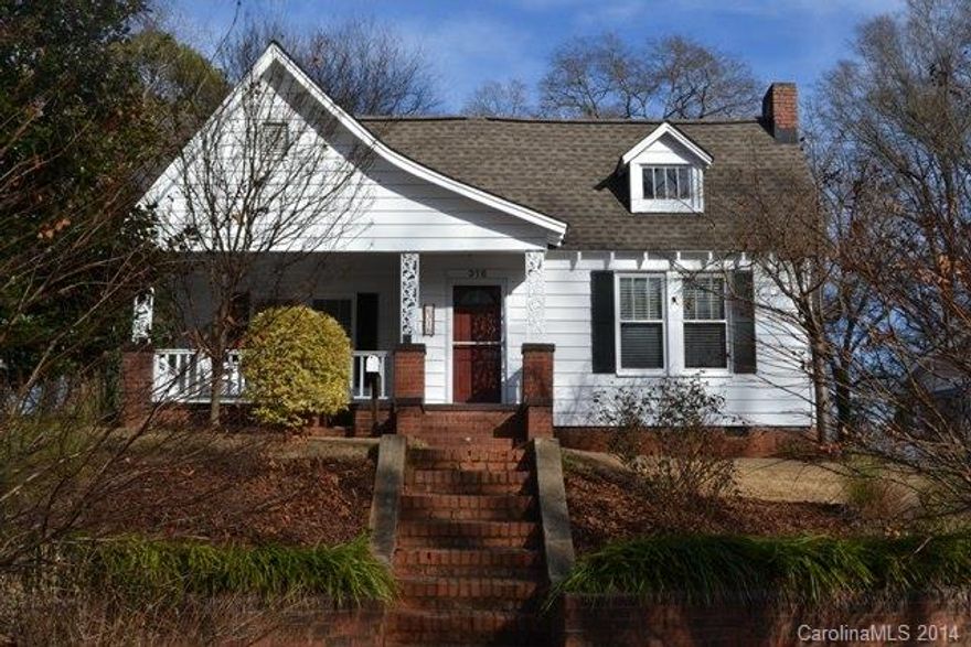 What a doll house!  This home offers 3 bedrooms and 1 bath, spacious living room and dining room.  Kitchen has ceramic tile floor, dishwasher and refrigerator.  Lovely hardwood floors in all bedrooms, DR and LR.  Replacement windows throughout, new water line to street and new breaker box.  Huge attic space, front porch and deck as well as fenced back yard.  A must see!  Exterior is aluminum siding.