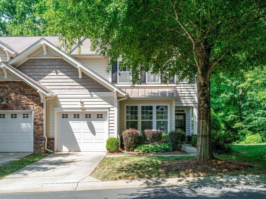 Welcome to this one-of-a-kind end unit townhouse in the desirable Cobblestone community! Set on a wooded lot, this home offers a private outdoor space with an oversized deck overlooking a large grassy area—perfect for relaxing or entertaining. Inside, you'll find a FRESHLY PAINTED INTERIOR (2025) and a bright 2-story great room with a fireplace and patio doors that seamlessly connect indoor and outdoor living. The kitchen overlooks the great room, creating an open layout with ample counter space for cooking and prep. Just off the kitchen, the sunlit dining room is ideal for everyday meals or entertaining. The main-floor primary suite features wooded views, a walk-in closet, and an en-suite with garden tub, separate shower, and double vanity. Upstairs offers two bedrooms, a full bath, and an open loft—perfect as a home office or bonus space. Additional highlights include main-level laundry and a one-car garage. Enjoy amenities including a pool, clubhouse, and playground.