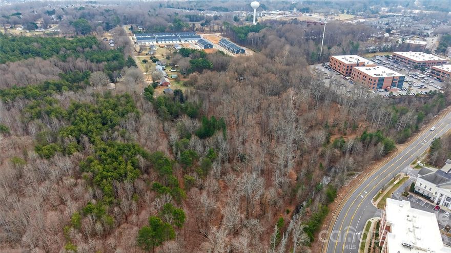 Positioned in a rapidly growing corridor, this +/- 7.78-acre assemblage offers an exceptional opportunity for investors, developers, or medical/office users. Located just moments from Duke Health Lake Norman Hospital and surrounding medical offices, this property is ideally suited for a variety of uses. Comprised of 12 parcels being sold together, the land is predominantly level, providing a strong foundation for efficient site planning and development. City water and sewer are available, adding to the property’s overall convenience and development readiness.
Currently zoned RMX, this site offers flexibility for residential, medical, or office use, making it an attractive option in an area experiencing significant growth and redevelopment. The close proximity to the new Duke Health facility continues to drive demand and investment, positioning this property for long-term upside. Whether you’re looking to develop a medical campus, office complex, or residential project, this property presents a rare chance to secure a sizable tract in a highly desirable and expanding location.