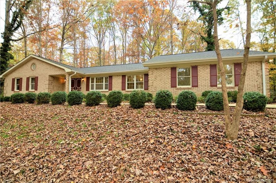 MOVE IN READY! Well cared for 3br/2ba custom brick home w/walk out basement. Freshly painted through out w/new carpet. Beautiful stone fireplace in the the den/gathering rm. Living rm open to dining rm. Partially finished walk-out basement that could be used as a second living area. Lg recreational rm, multi purpose rm w/closet (could be used as a sleeping room), retro wet bar & workshop. Fenced backyard, oasis w/fire pit. Min. from I-40 & I-77. Min. from Historic Downtown Statesville.