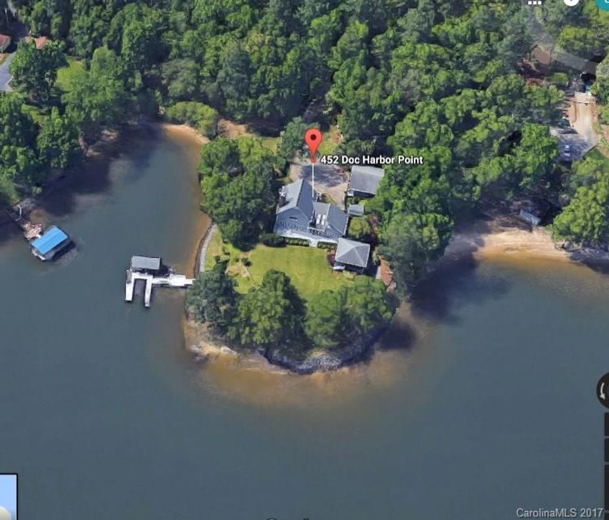 Beautiful one owner custom built Southern Living House Plan on a point lot with 692 ft. of water frontage on Lake Wylie's Big Allison. Features include vaulted ceilings, open floor plan, granite countertops, fireplace, 24x24 screen porch, 32x30 triple car garage, dock with boat lift and a manicured lawn with irrigation.