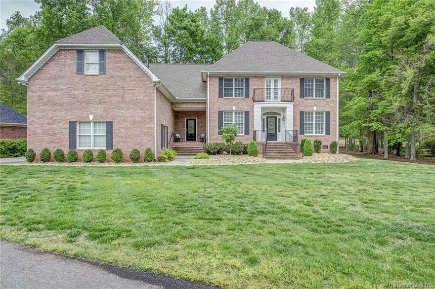 Beautiful estate home on the golf course at Cramer Mountain, a gated community close to Charlotte.  You know you have arrived when you drive across the bridge to this property.  Two master suites, one on the main level with vaulted ceilings and a second master upstairs.  Screen porch is the perfect spot to relax after a long day.  Tremendous storage in this home with 3 car garage.  Kitchen w granite and an eat at bar for easy entertaining.  Great room w fireplace. Lot is beautifully landscaped