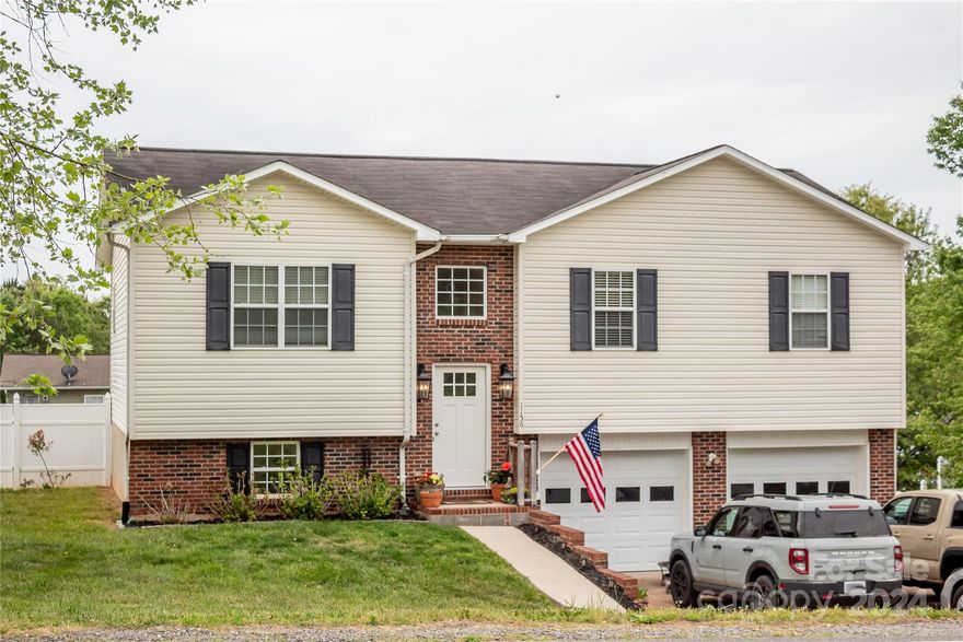 This is country living but with shopping, groceries and dining close by! Check out this great starter home in Alexander County with a Hickory address. This 3 bedroom, 2 bath offers spacious rooms, tons of cabinet space and a beautiful fenced backyard. The lower level offers so much potential for additional space and the duct work is already there for it. HVAC is only 3 years young. Come make this home yours