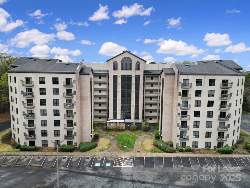 Welcome to this well maintained two bed two bath condo in Fort Mill. This home is located on the fifth floor in a building with an elevator for your convenience! Here you will find beautiful LVP flooring through the entire home, split floorplan with bedrooms on either side of the home, spacious primary bedroom with an en suite bathroom, generous living space, kitchen with ample counter and cabinet space, a balcony, and much more! Community features include a pool and tennis courts!