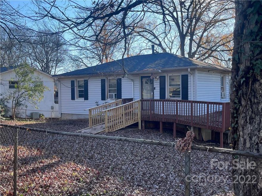 Build your dream home at this fantastic Noda location...large corner lot across from the North Charlotte park (corner of Spencer and Herrin). Home is part of an estate and being sold "as is". Lower level, the basement has a den and bedroom. The roof is newer as is the gas furnace. No working AC. Hardwood floors. Close to all that Noda has to offer. Walk to the 36th street Lynx station, great food, bars, breweries, yoga, restaurants and more.