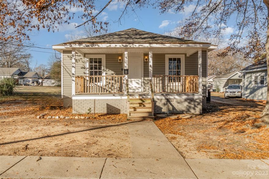 Spacious, light and airy two-bedroom bungalow in Kannapolis with over 1,000 square feet, original kitchen cabinets and updated countertop.  Beautiful hardwoods and 9' ceilings.  Enjoy one-level living and a flat yard, easy maintenance vinyl siding and a newer front porch.  Three streets from N. Ridge Ave and 1.5 miles from The Loop in Kannapolis, 4.5 miles to Walmart/Lowes on Dale Earnhardt shopping center.