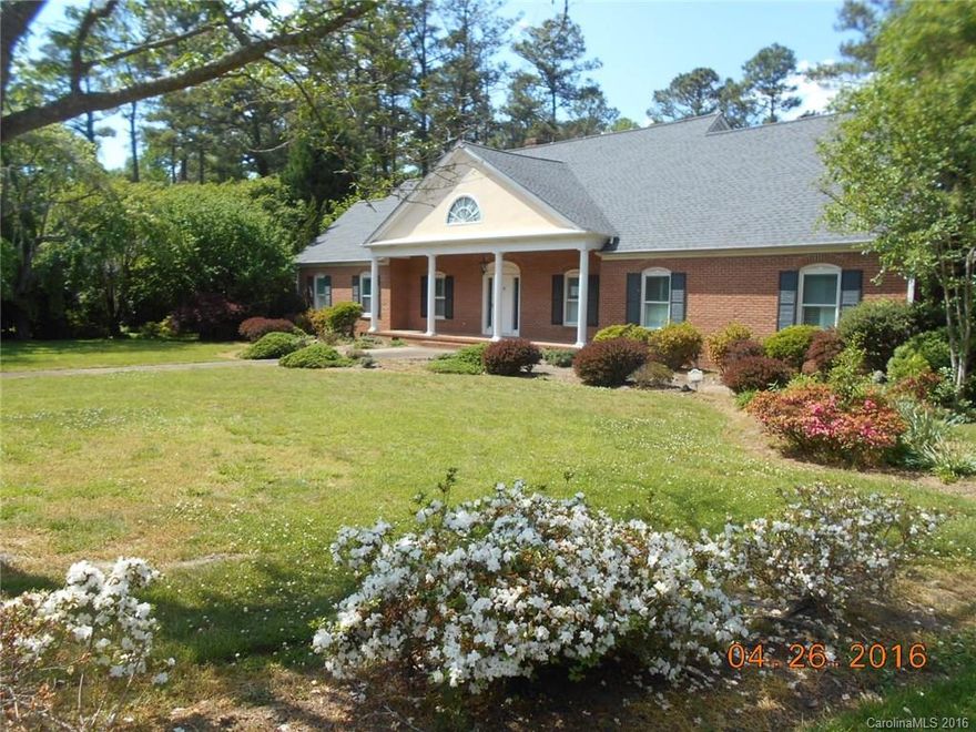 Elegant brick home with totally private 3.5 acre lot (2 lots combined) with creek running at the back of the property. Could build a guest house on the 2nd lot. Huge enclosed two level atrium overlooking 25 x 44 foot pool with pool storage house. Back yard has wrought iron fence with gates. 2 car oversized garage. 2 level Coy pond , tree house, large workshop building. Extensive landscaping on all sides. 5 bedrooms and 3.5 bathrooms above grade, Huge walk in attic spaces with large shelves,