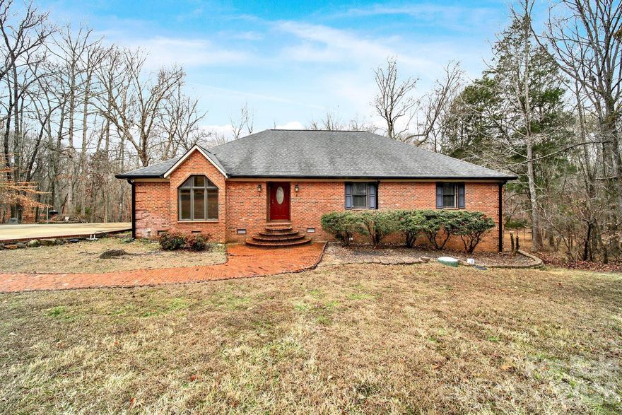 One's loss is another's gain... This is back on the market due to the previous buyer's financing falling through. If you’ve been waiting for space, privacy, and a setting that feels like a peaceful getaway, this well-maintained brick ranch on 2.4 acres delivers it all. Tucked away on a cul-de-sac with no HOA and no city taxes in a prime location of Catawba, SC, this brick home offers a solid and spacious layout with 4 bedrooms, 2 full bathrooms, 2 large living spaces, laundry room with sink and an eat-in kitchen. Step out onto the large trex deck from both the living room and the primary bedroom as you take in the view and serene water sounds of the gorgeous creek running along the back of the property. Notice the amount of storage you have inside, as well as outside, under the deck and in the impressive walk-in crawlspace with a garage door for easy equipment storage. Walk across the driveway to a hobbyist’s dream of a detached, three-bay heated and cooled garage plus workshop that easily fits several vehicles. The garage has it's own HVAC, water heater and a half bathroom. It also has several rooms to utilize for storage and/or offices, and a large carport right outside for extra vehicles or projects. Great location to retreat to after a long day while still close to the city and interstate for easy commutes to Charlotte and Columbia.