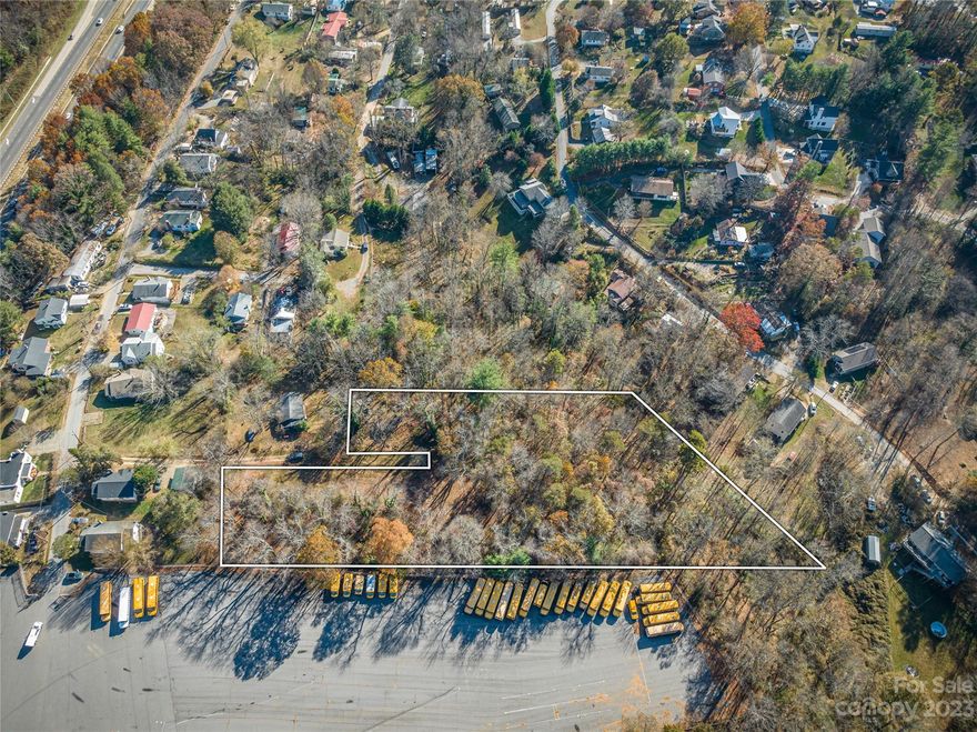 "Fantastic Development Opportunity": 14 Prime Lots Ready for Your Vision!  Located just off I-26 Exit 24 at Elk Mountain Road; these lots are located in the perfect area for your next build as it is conveniently located near many amenities.  Public water and sewer access flanks on both sides of the property.  Whether you are planning single-family homes, townhomes, or multi-unit residential buildings, these lots offer flexibility.  With the growing demand and need for quality housing in the area, your investment has the potential for substantial returns.  Don't miss out on this chance to create a thriving community in a high-demand area.  With a prime location and easy access to the I-26 corridor boasting convenience and accessibility, these parcels are perfect for future development.  Opportunities like this are becoming increasingly rare in our area, schedule a showing today and begin setting the foundation for your next development project. Owner financing available.