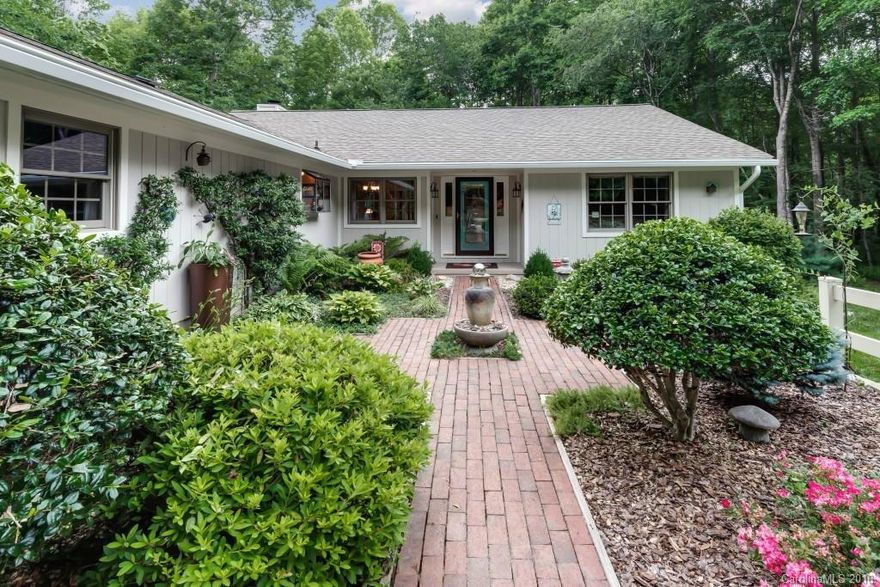 This unique property is nestled behind beautiful Meadowridge Subdivision. Enjoy the social benefits of living in a subdivision w/the privacy of a country home.  The foyer leads to an open concept living, dining & kitchen space. Wood burning fireplace. Access to screened porch & covered deck. Large utility room.  Sunroom w/endless pool.  2 car attached garage + utility garage. Detached garage/workshop. 2 Carports. Walking trails, pond and creek. Property is fully fenced w/gated entry.  Must see!