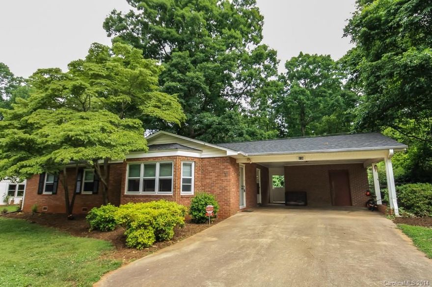 Charming full brick ranch in quiet community south of Statesville. Original hardwood floors, beautiful bay window and attractive fireplace welcome you home!  Bright and cheery kitchen with newer cook top, lots of counter space and breakfast bar.  Large dining room is open to kitchen.  Three spacious bedrooms.  New roof in 2014!  Fenced yard with storage building.. lots of room to garden or play.  Friendly neighbors. Country feel yet convenient to I-77, shopping, restaurants, and schools.