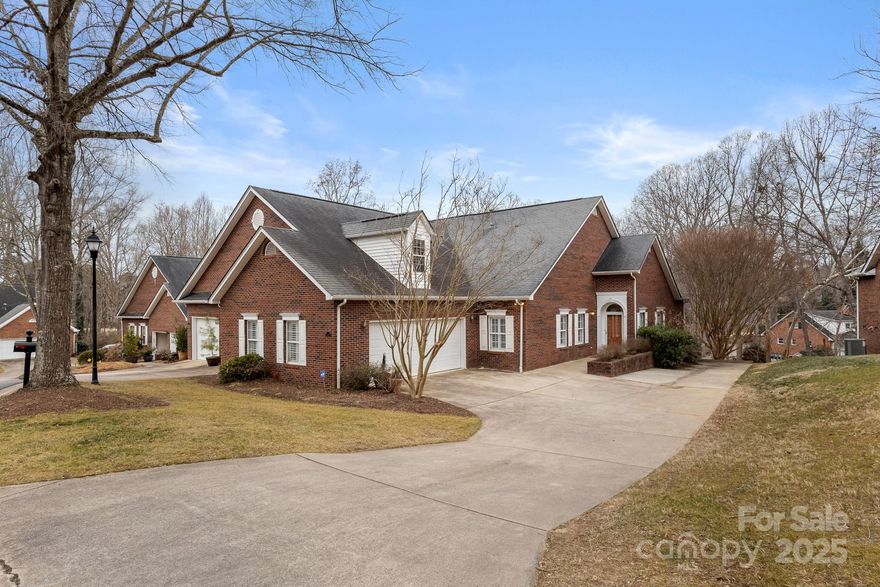 Premier END UNIT at THE COLUMNS w/ zero-step entry, FULL UNFINISHED BASEMENT, & expanded driveway with extra parking--this is the one you have waited for! On the main floor, there are 3 bedrooms, 2 bathrooms, & an open-concept living area with tons of natural light. The vaulted ceiling great room has a gas log fireplace and connects to a lovely sunroom w/ access to a spacious TREX deck w/ retractable awning off the back. The primary bedroom has tray ceiling, built-in book shelves, walk in closet, & en-suite bath w/ dual vanities, separate shower, & large tub. The kitchen overlooks the dining area & great room & features a walk-in pantry w/ convenient access to the 2 car garage for easy unloading. New carpet leads you down the steps to the unfinished basement--with HIGH ceilings, this could be finished into great additional living space or use it as a storage area or workshop. Are you ready to downsize? Are you ready for the lock it and leave lifestyle? Don't miss this special townhome!