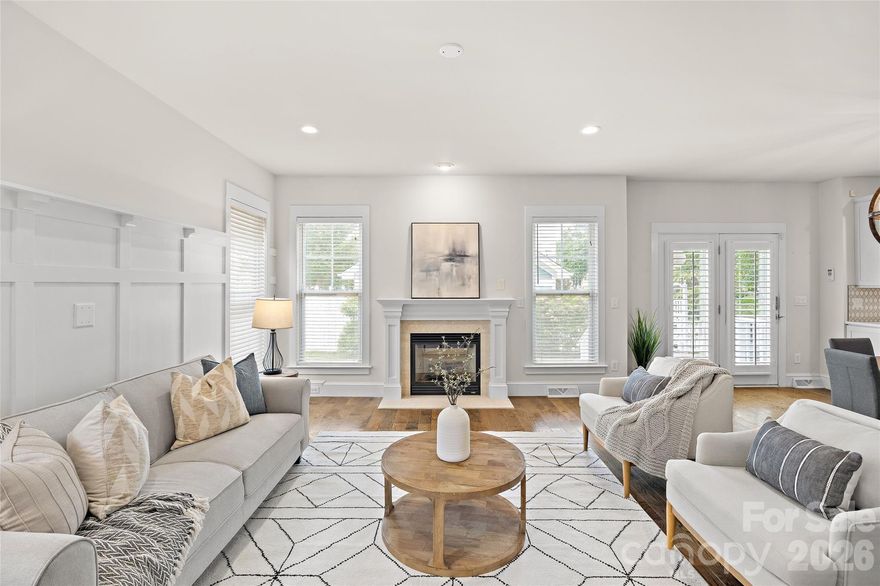 Welcome to this picturesque Charleston-style home set in the highly sought-after Monteith Park—an enchanting Southern community known for its tree-lined streets, vibrant green spaces, and exceptional amenities. From the inviting rocking chair front porch to the thoughtfully designed interiors this home shines. The kitchen, beautifully renovated, is both stylish and functional, featuring pristine white soft-close cabinetry, quartz countertops, farmhouse sink, pot filler, and a beautiful backsplash. Rich wood flooring flows through the main living areas and continues throughout the entire upper level, adding warmth and continuity. The bathrooms have been thoughtfully updated with modern finishes and elegant tile work. The downstairs space has a full bath and a room/flex space to utilize for a guest suite, office or play area. The primary suite is nothing short of extraordinary—an expansive retreat highlighted by a show-stopping custom closet complete with a center island, offering both beauty and function. A beautifully renovated bathroom designed with timeless sophistication, featuring a sleek frameless glass walk-in shower wrapped in classic subway tile and complemented by a rainfall shower head. The vanity is topped with elegant countertops and paired with polished fixtures and beautiful lighting. Statement tile work extends seamlessly to the walls, creating a bright, cohesive space, while natural light and clean lines enhance the spa-like feel. Outdoors, the fully fenced backyard offers a serene, park-like setting with lush landscaping—an ideal backdrop for relaxing or entertaining. The garage has amazing function if you want a home office, the space in the garage has a wall unit; or you can easily convert back to a 2 car garage. This house has a parking pad next to the garage on a well manicured corner lot. Welcome Home!