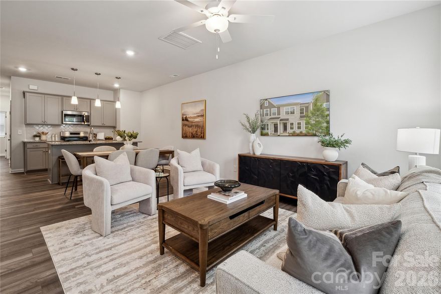 Welcome to this thoughtfully designed two-story townhome offering three bedrooms and two-and-a-half baths. Just inside the front entry, you’re greeted by a spacious open-concept family room that flows seamlessly into the kitchen and inviting eat-in dining area—perfect for both everyday living and entertaining.

Upstairs, the primary suite provides a comfortable retreat, complete with a boxed ceiling, a generous walk-in closet, and an en-suite bath featuring dual vanities. Two additional bedrooms and a full bathroom offer flexibility for guests, family, or a home office. A conveniently located laundry closet just outside the secondary bedrooms adds ease to daily routines.

Additional highlights include a one-car garage with direct entry, where you’ll find a powder room and a practical drop zone with built-in bench seating and cubbies—ideal for keeping everything organized and within reach.