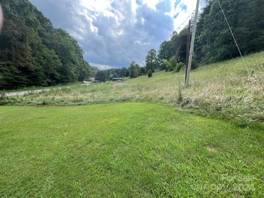 Older Homestead of 6 Acres m/l has gently rolling pasture to steeper hillside wooded area.  Property has space for pasture, gardening plus excellent knoll setting perfect for building your new home!  With long frontage on state paved road, there is easy access from numerous locations!  Property needs septic and well insalled, plus survey recommended.  Old house on property has "no value" and needs to be removed.  Good location, easy access to Town of Burnsville for shopping, etc.  You will enjoy country living here!