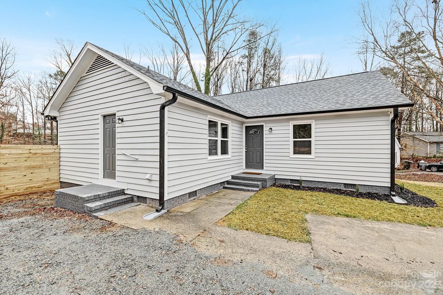 Nestled in a tranquil neighborhood, this newly renovated abode exudes charm and modernity. A sprawling back yard invites outdoor indulgence or tranquil retreats. Step inside to discover three inviting bedrooms. The primary bedroom, boasting vaulted ceilings which elevates the space with an airy, expansive ambiance, a haven of tranquility.  A sprawling sunroom, bathed in sunlight, serves as a versatile haven—a second sitting room or an inspiring office space. Its panoramic windows frame picturesque views of the lush outdoors, fostering a seamless connection between inside and out.  The living room, adorned with its own vaulted ceilings, anchored by a fireplace. A fusion of modern aesthetics and functionality defines the kitchen, with stainless steal appliances and butcher block counters, making culinary endeavors a delight. This renovated dwelling harmonizes indoor comfort with outdoor allure, embodying contemporary living.