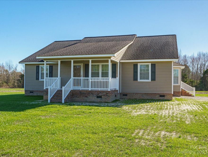 So much "new" to this attractive, 1850 sq. ft., 3BR/2BA home- you don't want to miss it! Situated on a 1 acre lot in Cheraw, just outside the city limits, this property is very conveniently located to Highway 9, shopping, schools, recreation, and healthcare. It has all NEW: heat pump, water heater, (Pex)plumbing throughout, septic system, interior six panel and bifold doors, and kitchen appliances. An "eat-in" kitchen, separate laundry room, and large primary bathroom are huge "pluses," as well. Adding to the maintenance free exterior of freshly washed vinyl siding are the new PVC porch rails and spindles throughout. Speaking of porches, this one has a welcoming, floating cement front porch, as well as great, covered porch space for relaxing or grilling off the back. Well maintained and freshly painted throughout, this one truly is move in ready with nothing to worry about! Make an appointment to see it soon!