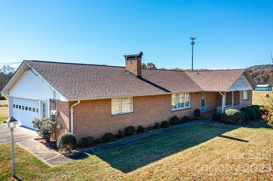 Lovely country setting featuring a ranch style home from the 1960s. The 3 BR/2 BA home offers one-level living with garage and laundry area. Nice sized rooms & natural light throughout the home. Excellent structure with newer roof of 30 yr architectural shingles. Adjoining level lot features garage/workshop/storage of 1800 sq ft makes the uses endless. Roof was installed in 2021.