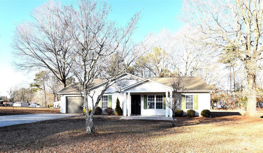 Nestled off the main highway in a place to call home.  Take a look at this 3 bedroom, 2 bath home that is move-in ready.  Beautiful wood floors in several rooms, a convenient kitchen and dining area, and a large great room for get togethers.  You'll enjoy the covered patio for cookouts.  The one car garage is just off the laundry room.  Priced to sell.