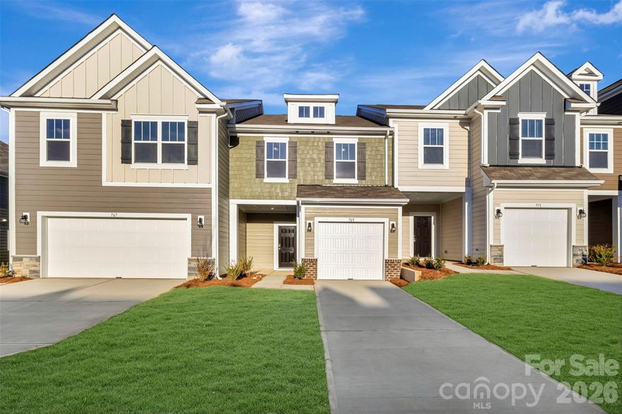 Welcome to the Manchester! This 3-bed, 2.5-bath townhome offers the ideal space. Enter through the front porch or 1-car garage to a welcoming foyer with a convenient powder bath and storage closet. The heart of the home includes the kitchen, breakfast area, and family room, seamlessly connected for an easy flow. Enhance the kitchen with bar stools for entertaining. The spacious family room accommodates a sectional and more. Step outside to a charming back patio, adding a rare touch of privacy for a townhome. Throughout the main level is easily maintainable EVP flooring to make cleaning a breeze. Upstairs, the owner’s bedroom fits a king bed with room for a reading chair. Accented with a tray ceiling and LED lighting, you'll feel like royalty. Enjoy an en-suite bathroom and a sizable walk-in closet. Two additional bedrooms, a full bath, and a laundry room complete the second level. This townhome is designed for comfort and convenience, providing the perfect blend of space and style. Welcome home to the Manchester!