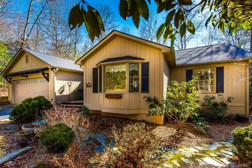 Move-in Ready 3BR/2BA home with private dock on Largest Lake in Connestee Falls! Lovely setting, vaulted ceilings, skylights, crown molding, stone Wood burning FP. Open Floor plan w/wood ceiling. LG eat-in kitchen w/plenty of counter space & pantry! LG MBR w/vaulted ceiling, walk-in closet. Split floor plan! YES - this home has lake views and a walking path to private dock on Lake Atagahi! Convenient location close to Gate & Clubhouse. Buyers to pay CFPOA UAFee of $8000.