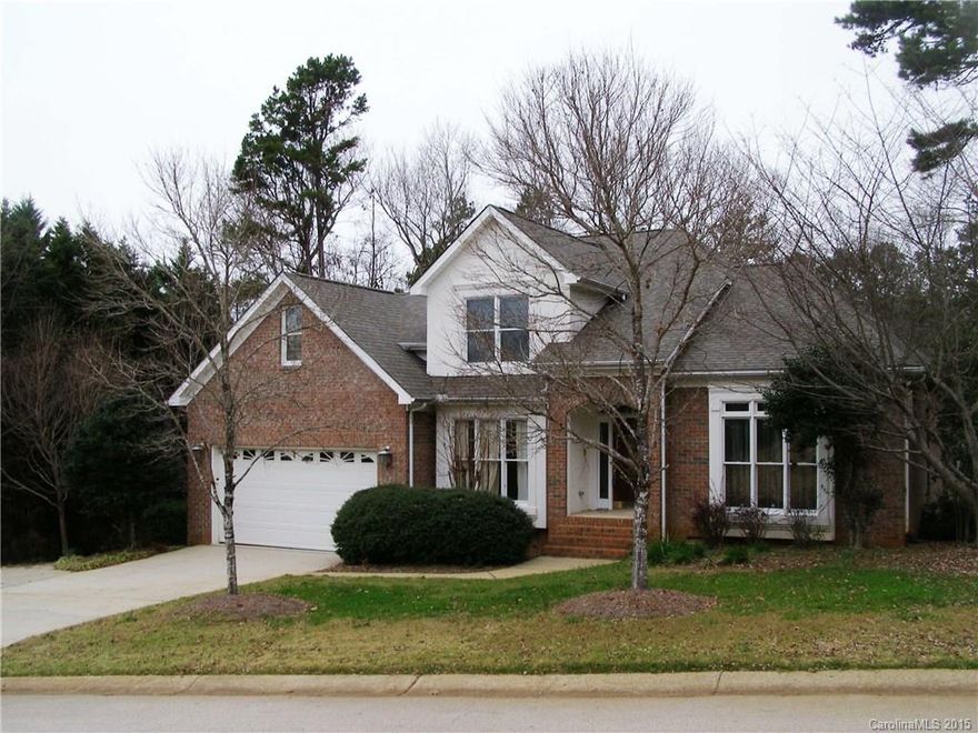 Lovely private setting in Tega Cay!  Fresh Paint and new Carpet in this 4 bedroom brick home. Main level Master Suite w/walk-in closet, dual sink vanity.  Granite counter tops in kitchen + breakfast bar. Stainless appl including gas range/oven. Spacious two story Great room has built in cabinets and gas fireplace.  Large formal areas. Upstairs Bonus.  Extensive hardwoods. Tons of storage throughout. Enjoy the multi level rear decks for relaxing or entertaining. Award-winning Fort Mill Schools!