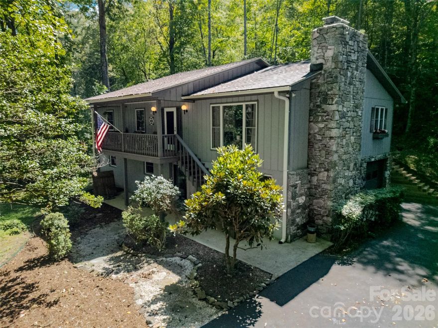 Prime Location Meets Comfortable Living in Knob Creek. This beautifully maintained home is nestled in the heart of the Knob Creek community. The thoughtfully maintained home combines modern comfort with the beauty of nature—all just minutes from downtown Brevard, Pisgah National Forest, and a scenic drive to Cedar Mountain. Wake up to birdsong and sip your morning coffee on the inviting front porch, where forested surroundings offer a peaceful sense of privacy. Inside, you’ll find an open-concept layout that brings people together, a beautifully remodeled kitchen ideal for home chefs, and generously sized bedrooms that provide plenty of space to unwind. Downstairs, a cozy den with a wood stove offers the perfect place to relax on cooler evenings, while a bonus room, two additional bedrooms and full bath add flexibility for guests, in-law-suite, hobbies, or a home office. The attached garage—with its own workshop space—has served the current owner well and awaits your own creative touch. Knob Creek is an established, well-loved neighborhood featuring a dedicated volunteer board, private road maintenance, and its own water system. Learn more about the community at www.knobcreekhoa.com