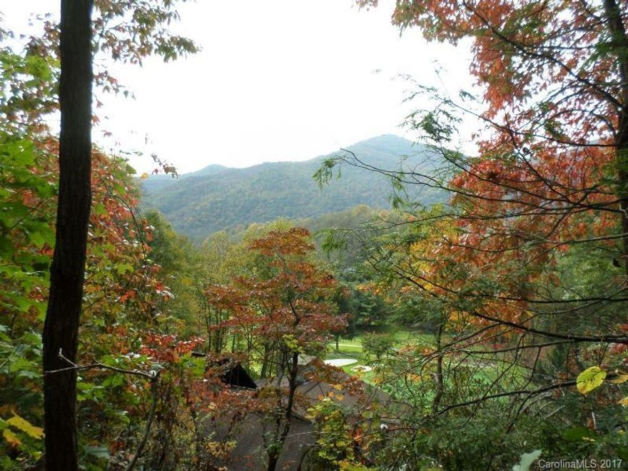 Maggie Valley Country Club overlooking golf course & beautiful mountain views. Driveway partially cut-in. Paved, easy, street access. City water, sewer. Club House, restaurant, golf, tennis, spa, pool, hot tub, amenities available, Course & Dining open to public. For a lifestyle change to mountain views & peaceful setting, with convenience of town close by - this is it (Wville 10 min, Asheville 25 min), Adjoining .05 acre available to add road frontage, driveway options