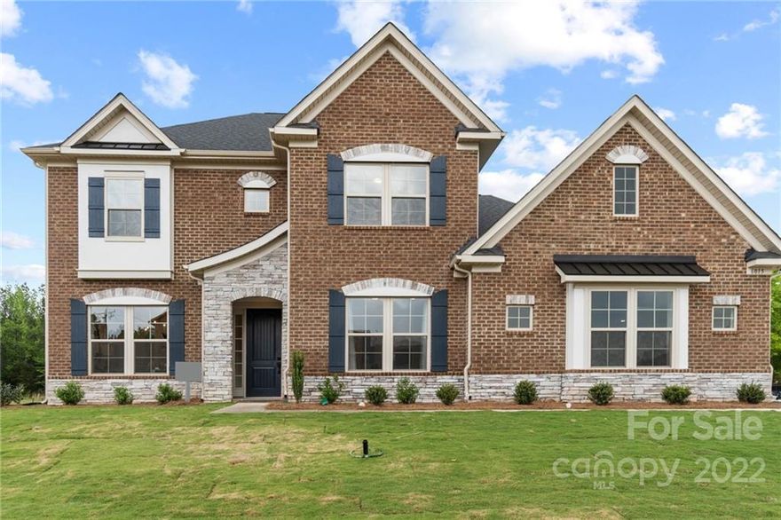 Breathtaking must-see home in The Estates at Covington! Stunning curb appeal, open floor plan, & luxury finishes throughout! Open foyer leads to spacious main level w/ beautiful vinyl flooring & tons of natural light throughout. Formal dining room w/ modern chandelier, tray ceiling, & decorative wainscoting perfect for hosting gatherings. Open great room features cozy fireplace & oversized windows. Elegant kitchen w/ stainless steel appliances, wall oven, breakfast bar, tile backsplash, butler's pantry, & sunny breakfast area! Owner’s suite on main level w/ tray ceiling & huge walk-in closet! En-suite bathroom w/ decorative tile flooring, his & her sinks, soaking tub, & tiled walk-in shower. 2nd level features spacious secondary bedrooms w/ modern touches, bathrooms, & large bonus room w/ computer niche. Backyard features screened in patio, patio w/ outdoor fireplace, & huge yard perfect for relaxing, grilling, & entertaining! Great Indian Land location!