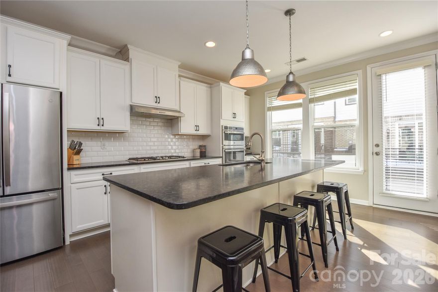 Welcome to 612 Tudor Park Way, a bright and modern three-story townhome in the desirable Wendwood Terrace community in always charming Cotswold. This 4-bedroom, 3.5-bath townhome features an open-concept layout, abundant natural light, and no carpet to be found - offering a clean, contemporary feel throughout.

The entry level includes a 2-car garage as well as a private guest bedroom with a full bath - ideal for guests or a home office. The main living level showcases a spacious gathering area, dining space, and a gourmet kitchen with upgraded white cabinetry, granite countertops, a gas cooktop, and convection microwave and oven. Step out onto the deck to enjoy morning coffee or fresh air.

Upstairs, you’ll find two secondary bedrooms, a full hall bath, and a generously sized primary suite. 4-bedroom and 3-full bathroom units are hard to come by in this community! 

The neighborhood features a central pocket park, sidewalks, and a dog park, all just minutes from SouthPark, Elizabeth, Plaza Midwood, Uptown, and more. A must-see home offering comfort, style, and unbeatable access to all of Charlotte’s best amenities.