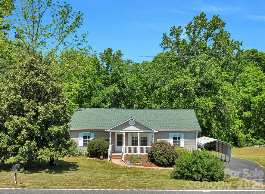ABSOLUTELY MOVE-IN READY 3 bedroom 2 full bath home with 720 square foot detached garage or workshop building, fenced yard, and even a whole house Generac generator! New HVAC, water heater and roof in 2023. Clean and shiny, beautifully maintained interior - this home shows like a new house! You will not find a better property in this price range. Paved driveway, convenient location in District 1 school system. Garage has electric and a full slab. Laundry room with washer, dryer, and full freezer that all convey. Public water and the original well is on the property, it has water and a working pump but is not currently hooked up to the house.  Leased 250 gallon propane tank is 80% full. This property is a GREAT value.