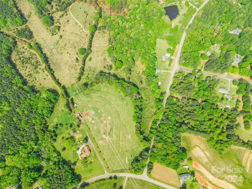 Explore the possibilities with this expansive parcel of vacant land, offering mostly flat terrain and a gated entrance. Perfect for agricultural use or development, this property boasts the charm of farm land with its wide-open spaces and serene surroundings. Whether you're dreaming of starting a new farming venture or envisioning your own custom estate, this land provides a blank canvas for your aspirations. Don't miss this opportunity to make your rural living dreams a reality.